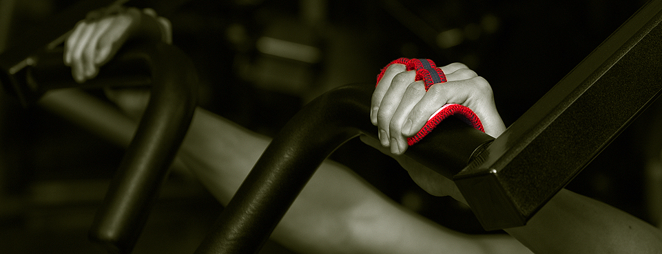 Red Workout Gloves on Bench Machine